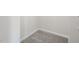 This is a corner of a room with gray carpet and light gray walls at 1515 Tamarisk Ln, Durham, NC 27703