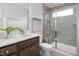 Modern bathroom with a glass-enclosed shower, stylish vanity, and neutral color palette at 1517 Tamarisk Ln, Durham, NC 27703