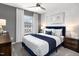 Stylish bedroom with a ceiling fan, neutral colors, and a comfortable bed at 1517 Tamarisk Ln, Durham, NC 27703