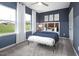 Comfortable bedroom with big windows and ample light at 1517 Tamarisk Ln, Durham, NC 27703