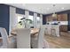 Open concept dining area with wood table, natural light, and seamless flow to the kitchen at 1517 Tamarisk Ln, Durham, NC 27703
