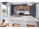Stylish kitchen with granite counters, stainless appliances, and pendant lighting over the island at 1517 Tamarisk Ln, Durham, NC 27703