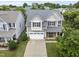 Aerial view of a two-story home with a two-car garage and a well-manicured lawn at 1720 Laurel Park Pl, Cary, NC 27511