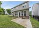 Backyard with well-maintained lawn and exterior view of the home at 1720 Laurel Park Pl, Cary, NC 27511