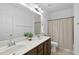 Neutral bathroom featuring a double sink vanity, white cabinets, and a shower and bathtub at 1720 Laurel Park Pl, Cary, NC 27511