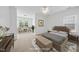 Bedroom featuring a cozy seating area and warm decor throughout at 1720 Laurel Park Pl, Cary, NC 27511