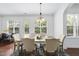 Bright dining area with a neutral rug, a pendant light, and backyard access, perfect for casual dining experiences at 1720 Laurel Park Pl, Cary, NC 27511