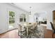 Well-lit dining space with access to the backyard and living room, ideal for seamless indoor-outdoor living at 1720 Laurel Park Pl, Cary, NC 27511