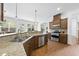 Well-equipped kitchen with stainless steel appliances, granite counters, and a breakfast bar at 1720 Laurel Park Pl, Cary, NC 27511