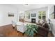 Cozy living room with hardwood floors, a fireplace, and an open layout, ideal for entertaining guests at 1720 Laurel Park Pl, Cary, NC 27511