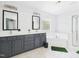 Bathroom features double sinks, a soaking tub, and bright lighting at 1728 Callandale Ave, Cary, NC 27518