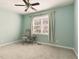 Neutral bedroom with a chair, a window, and curtains at 1728 Callandale Ave, Cary, NC 27518