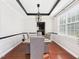 Dining room features modern lighting, updated trim, and hardwood floors at 1728 Callandale Ave, Cary, NC 27518