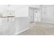 Hallway with access to rooms and staircase with wooden trim at 1728 Callandale Ave, Cary, NC 27518
