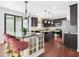 Kitchen boasts stainless steel appliances, granite countertops, and bar seating at 1728 Callandale Ave, Cary, NC 27518