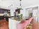 Kitchen boasts stainless steel appliances, granite countertops, and bar seating at 1728 Callandale Ave, Cary, NC 27518