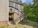 Exterior staircase to a deck with ample storage space underneath at 1728 Callandale Ave, Cary, NC 27518