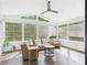Bright sunroom with wicker furniture and lots of windows offering plenty of natural light at 1728 Callandale Ave, Cary, NC 27518