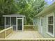 Backyard with a screened-in porch accessible by a wooden deck at 1905 Bivins St, Durham, NC 27707