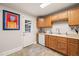 Functional kitchen with light oak cabinetry, a stainless steel sink and white appliances at 1905 Bivins St, Durham, NC 27707