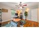 Spacious office featuring a functional desk setup and beautiful hardwood flooring at 1905 Bivins St, Durham, NC 27707