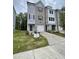 Charming new construction townhome with gray brick and siding and a one car garage at 1912 Fishamble St # 20, Fuquay Varina, NC 27526