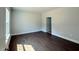Comfortable bedroom with hardwood floors and neutral paint, ready for personal touches at 1998 Meadowview Dr, Graham, NC 27253