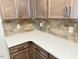 Close-up of the beautiful countertops and backsplash in this kitchen with modern cabinetry at 1998 Meadowview Dr, Graham, NC 27253