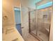 Bathroom boasts a glass-enclosed shower with a built-in seat and tiled walls at 1998 Meadowview Dr, Graham, NC 27253