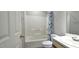Bathroom featuring a bath tub with a shower, and a vanity with a sink at 204 Kirkwood Dr, Chapel Hill, NC 27514