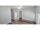 Bedroom with wood-look flooring leading into an ensuite bathroom and a walk-in closet at 204 Kirkwood Dr, Chapel Hill, NC 27514