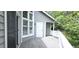 A serene deck boasts a door, windows, and light gray wood flooring at 204 Kirkwood Dr, Chapel Hill, NC 27514