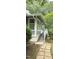 Quaint two-story home with a stone pathway to a covered porch and stairway at 204 Kirkwood Dr, Chapel Hill, NC 27514