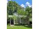 Charming home exterior with a manicured lawn, mature trees, and a welcoming entrance in a desirable neighborhood at 204 Kirkwood Dr, Chapel Hill, NC 27514