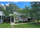 Home exterior featuring well-maintained landscaping, a light-colored facade, and inviting curb appeal on a sunny day at 204 Kirkwood Dr, Chapel Hill, NC 27514