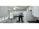 Bright kitchen features white cabinets, black hardware, modern appliances, and contrasting countertops at 204 Kirkwood Dr, Chapel Hill, NC 27514