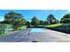 An open tennis court offers a fenced recreational space surrounded by trees at 204 Kirkwood Dr, Chapel Hill, NC 27514