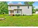 Exterior back view featuring a large yard and bay window at 212 Spearhead Pl, Clayton, NC 27520