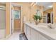 Bright bathroom with a white double sink vanity and a separate shower/tub area at 212 Spearhead Pl, Clayton, NC 27520