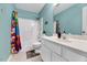 Inviting bathroom showcasing a shower/tub combination with playful shower curtain at 212 Spearhead Pl, Clayton, NC 27520