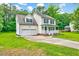 Attractive two-story home with a garage and a well-maintained front lawn at 212 Spearhead Pl, Clayton, NC 27520