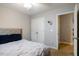 Bedroom showcasing a ceiling fan, double closet, and hallway access at 215 Outwater Ridge Dr, Garner, NC 27529