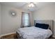 Comfortable bedroom showcasing a ceiling fan and large window at 215 Outwater Ridge Dr, Garner, NC 27529
