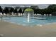 Community pool with mushroom water feature and lounge chairs at 215 Outwater Ridge Dr, Garner, NC 27529