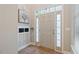 Bright entryway with beautiful wood floors, coat rack, and lots of natural light at 215 Outwater Ridge Dr, Garner, NC 27529