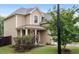 Exterior shot of a well-maintained home with a lush lawn and inviting front entrance at 215 Outwater Ridge Dr, Garner, NC 27529