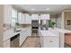 Well-appointed kitchen featuring white cabinets, granite countertops, stainless steel appliances, and ample storage space at 215 Outwater Ridge Dr, Garner, NC 27529