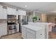 Beautiful kitchen with stainless appliances and marble countertops offering an open layout to the rest of the home at 215 Outwater Ridge Dr, Garner, NC 27529