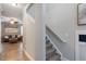 Cozy living room with hardwood floors, a staircase, and comfortable seating arrangement at 215 Outwater Ridge Dr, Garner, NC 27529