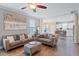 Cozy living room featuring an open layout, hardwood floors, and modern furnishings at 215 Outwater Ridge Dr, Garner, NC 27529